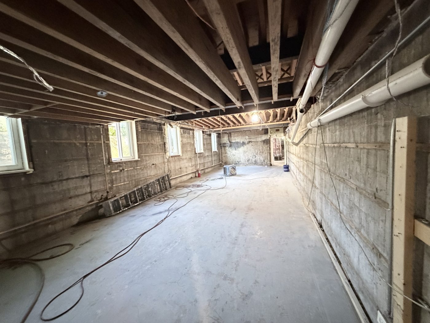 The basement level cleared to bare concrete, ready to become new adult classrooms